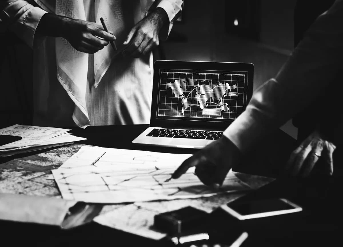A strategist reviewing plans and analytics at a desk